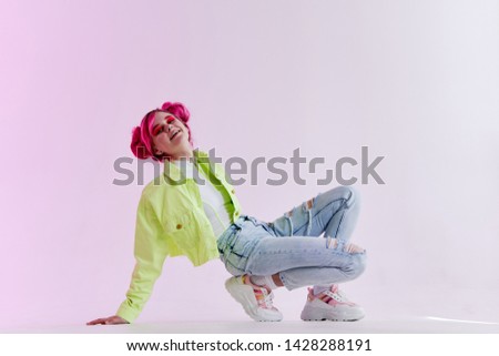 woman with hairstyle sat down jeans style