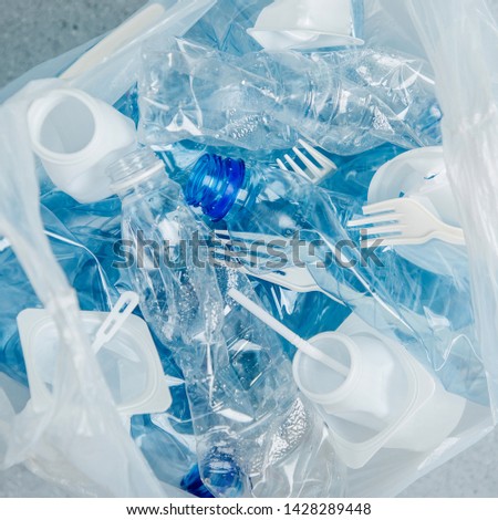 Food plastic packaging in plastic bag.  Concept of Recycling plastic and ecology. Flat lay, top view
