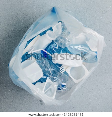 Food plastic packaging in plastic bag.  Concept of Recycling plastic and ecology. Flat lay, top view

