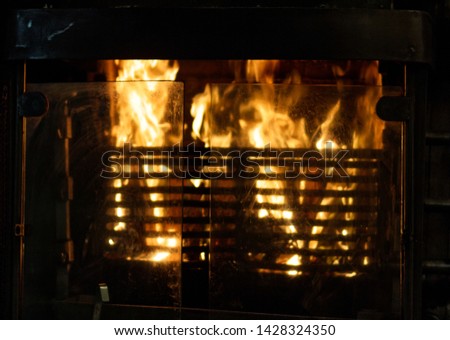the fire burning in grill oven