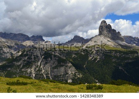 Beautiful day in Dolomites Mountains, Italy. Tre Cime on background. Picture takem from Monte Piano Mountain.