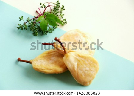 Dried pears isolated on abstract soft color background. Royalty-Free Stock Photo #1428385823