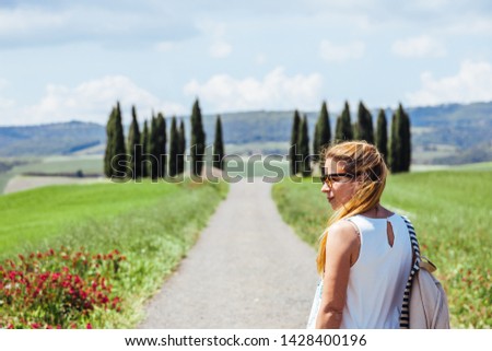 Young woman traveling through Tuscany, Italy
