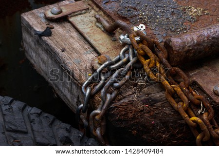 Rusted steel chain at the pier. Focus on chain (select focus) 