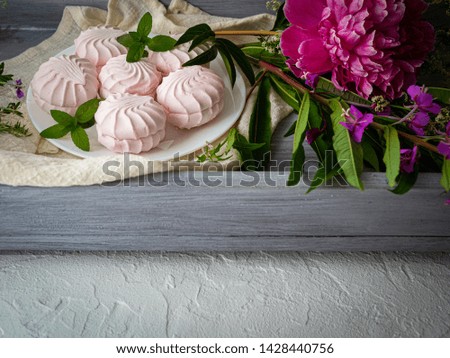 Beautiful composition with pink marshmallows and bright colors. Copy space.