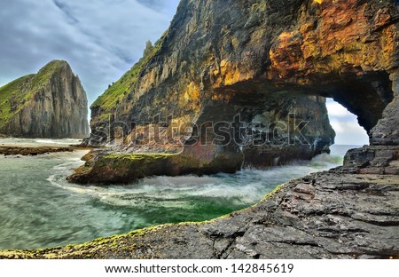Hole in the wall, Eastern Cape, South Africa Royalty-Free Stock Photo #142845619