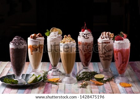 Different milkshakes assorted summer cold milkshakes  Royalty-Free Stock Photo #1428475196
