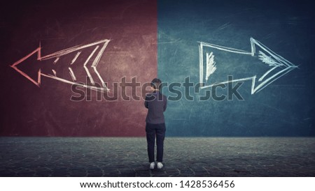 Rear view of doubtful businesswoman in front of a split wall as arrows leads in two different ways red and blue side. Correct choice left or right, failure or success. Difficult decision concept. Royalty-Free Stock Photo #1428536456