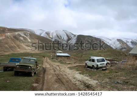 Scenic landscape of mountain valley with cars, Dagestan, Russia 