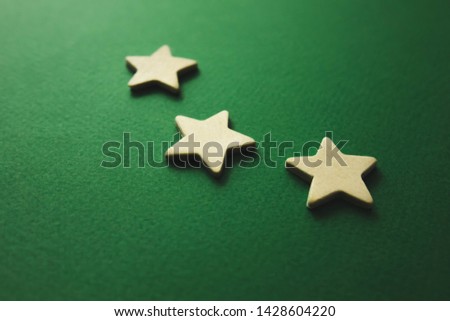white stars on a green background.