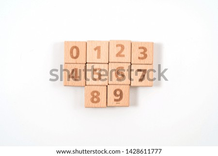 Arabic numerals on wood ,white background