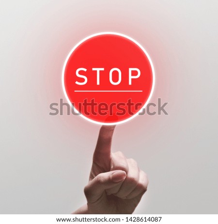 Woman Finger Pushing red round Stop sign, copy space
