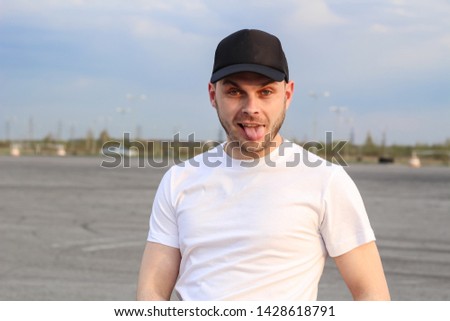 Charismatic man in a white T-shirt. Advertising Banner Fashion and Style. Mockup.Copyspace