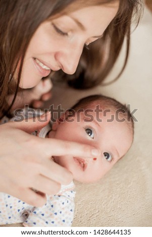 Little baby in mother's hands.