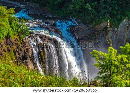 Colorful Double Rainbow and Clear Skies Over Snoqualmie Falls in Washington