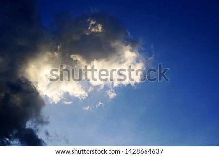 Dark clouds with sky blue color background in the evening of the rainy season