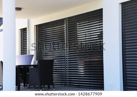 Window with modern blind, exterior shot Royalty-Free Stock Photo #1428677909