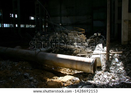 Ruins of an old industrial building. Abandoned production. Disassembly work.