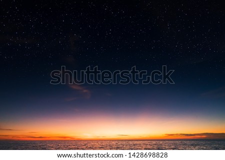 Starry dusky sky scenery over the sea. Royalty-Free Stock Photo #1428698828