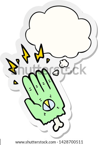 spooky halloween zombie hand with thought bubble as a printed sticker