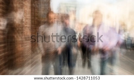 Street abstract - long exposure of pedestrians walking along the high street - intentional camera shake to introduce an impressionistic effect and light trails - creative filter applied