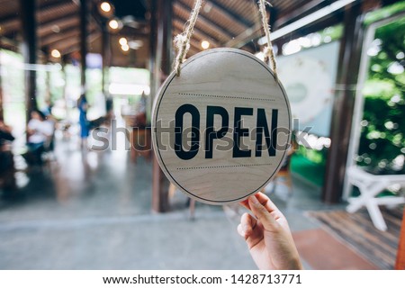 Open sign in coffee shop, Working in cafe.
