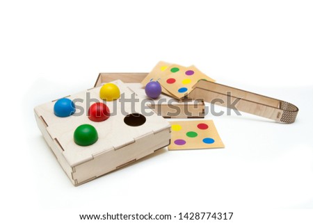 Developing children's wooden toys on a white background. The first games for the baby. Wood products. Handwork. ECO