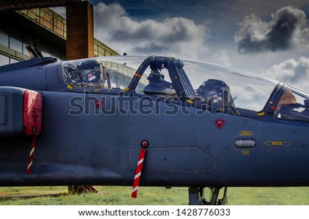 Side view of cockpit of Fighter jet   Royalty-Free Stock Photo #1428776033