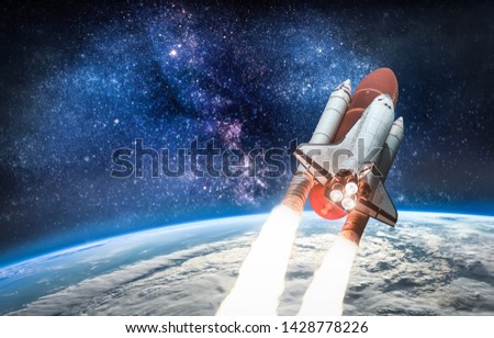 Space shuttle launch in the open space over the Earth. View from ISS. Ocean and sky under space ship. Elements of this image furnished by NASA