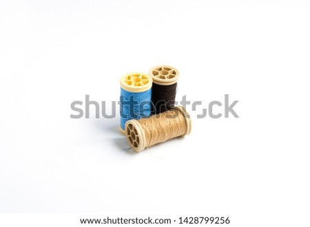 reels of thread on a white background