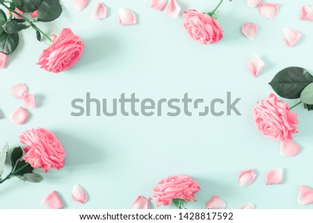 Beautiful flowers composition. Pink rose flowers on pastel mint background. Valentines Day, Easter, Birthday, Mother's day. Flat lay, top view, copy space