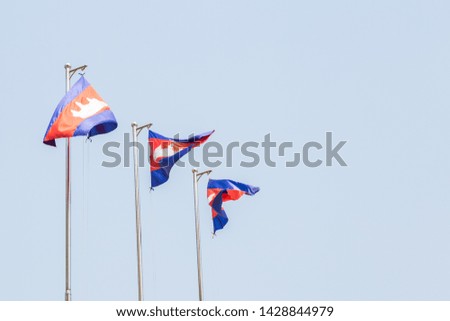 three cambodia flags on flagpoles