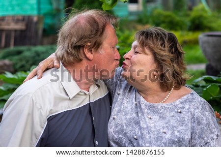 Mature couple resting in the Park and talking