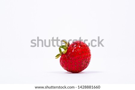 Closeup of a strawberry on white background.