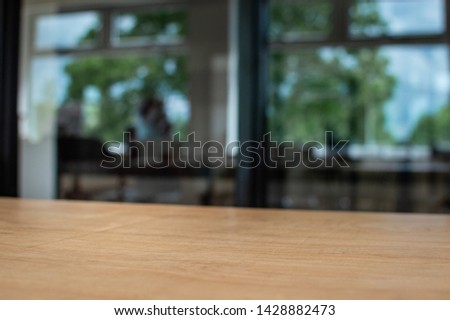 Picture of a wooden plywood table. shalow depth of field, blurred background.