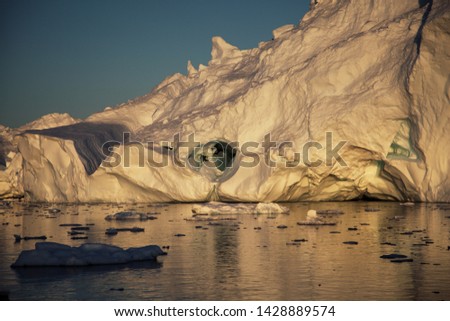 Huge Icebergs with water reflection Ilulissat Greenland