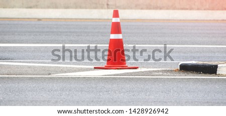 Orange Traffic Cone on highway