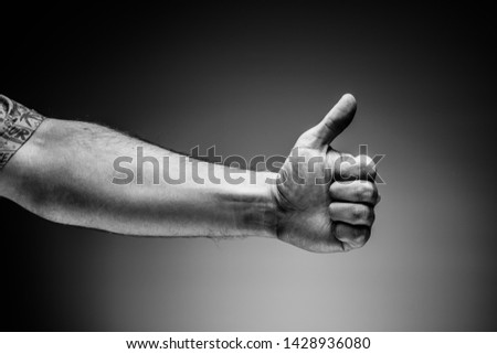 Mans hand gesture on the gray background