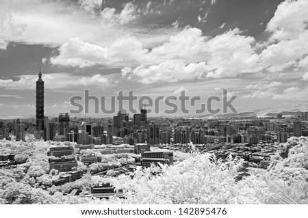 Taipei cityscape with famous landmark, 101 skyscraper under dramatic sky, infrared photography. Shoot at Taipei, Taiwan, Asia.