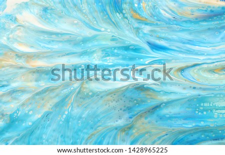 photography of abstract marbleized effect background. Blue, mint, gold and white creative colors. Beautiful paint
