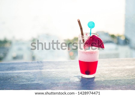 Pink cocktail in a glass with a sunset view on the sea coast of Pattaya, Thailand