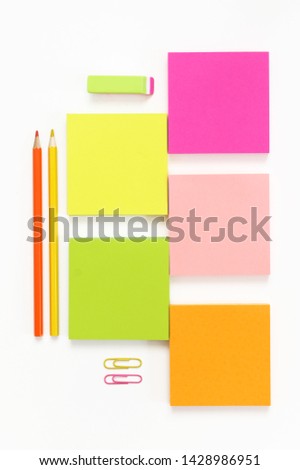 Colorful stationery set as border on white background. Top view, flat lay.