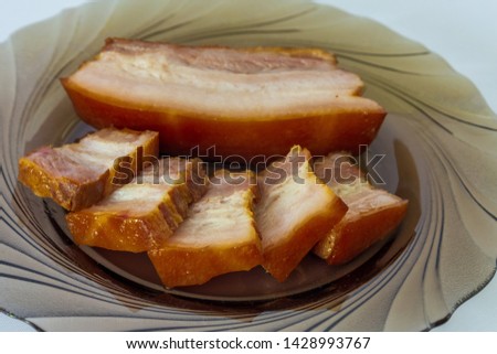 Smoked pork belly on a plate.