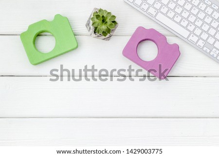 photo camera for blogger with keyboard on white wooden background top view mock up