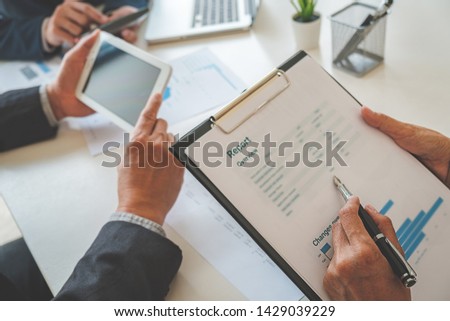 Administrator business man financial inspector and secretary making report calculating balance. Internal Revenue Service checking document. business concept