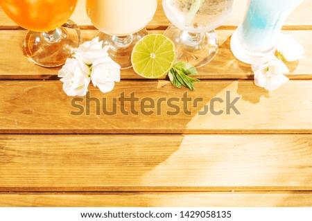 Sliced lemon flower mint and bright drinks 