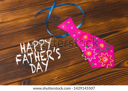Happy fathers day sign on paper  laid on wooden floor backround. - Image 