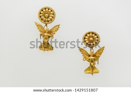 Etruscan style gold erarrings pendant detail isolated on white