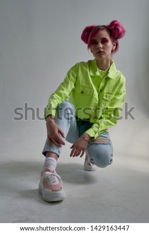 stylish woman sits pink hair