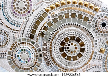 concrete wall or plaster wall texture painted with vintage tone color and decorated by many type of mosaic feeling different other wall suitable for background creative work